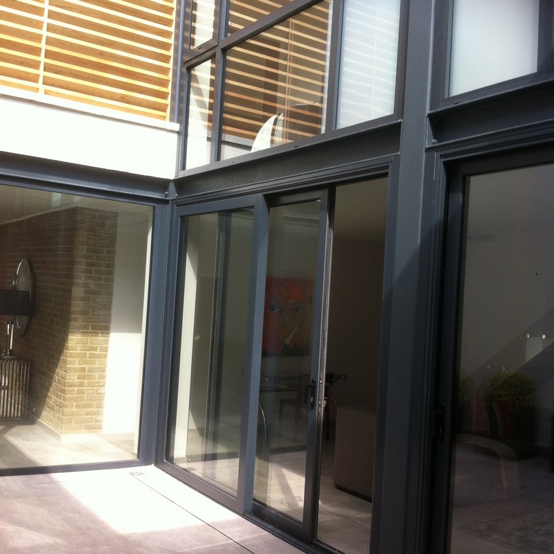 Anthracite aluminium sliding patio doors fitted in Cobham