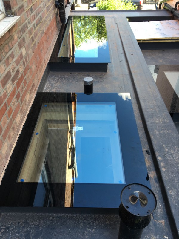Multiple flat roof skylights on extension in Cobham