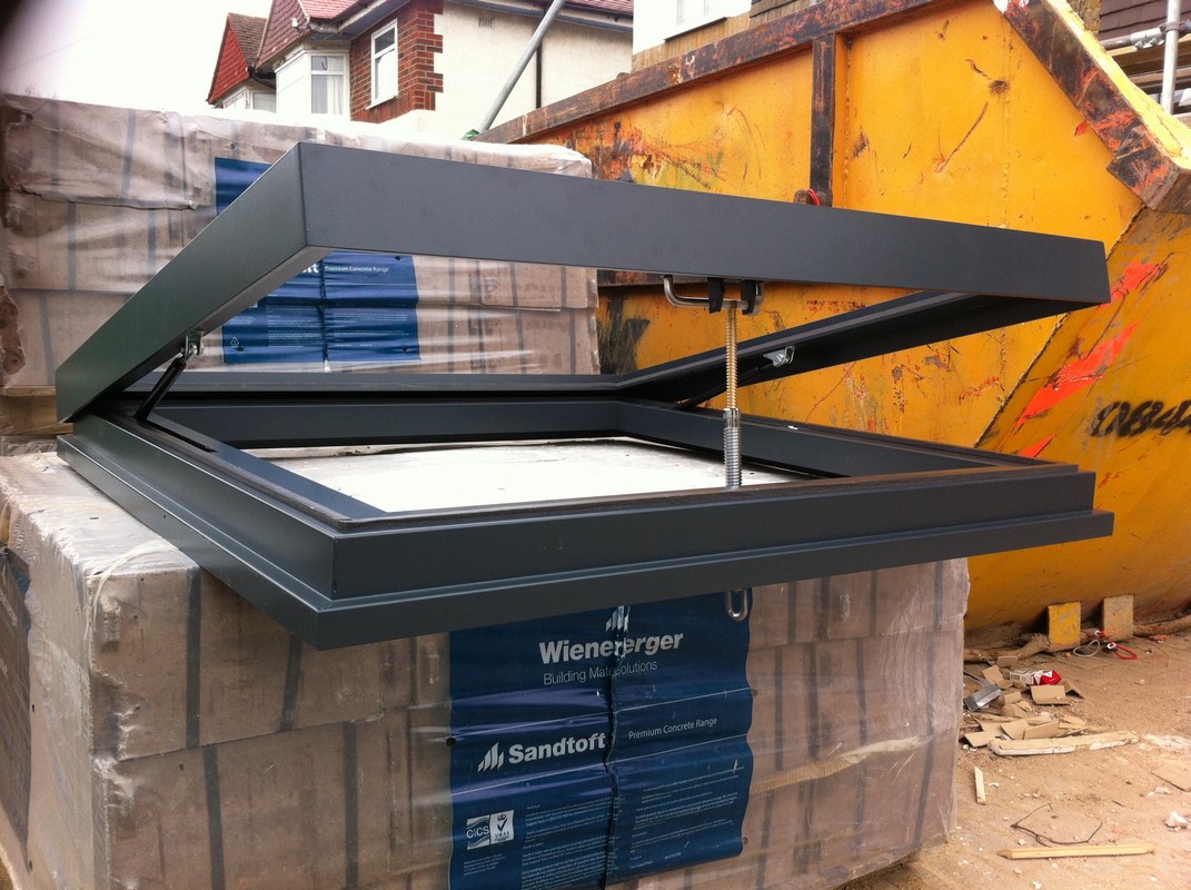 Opening flat roof skylight in anthracite grey installed in Cobham